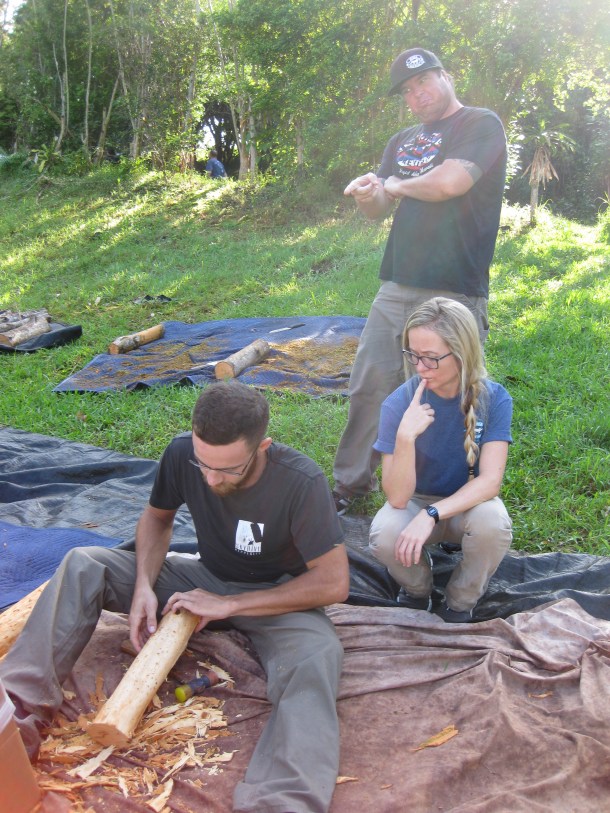 Kona Brewing Co. Brewer David Dumas scraping bark with Sandi Shriver and Benjamin Farish managing